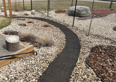 low maintenance play area and walkway by Lush Landscaping