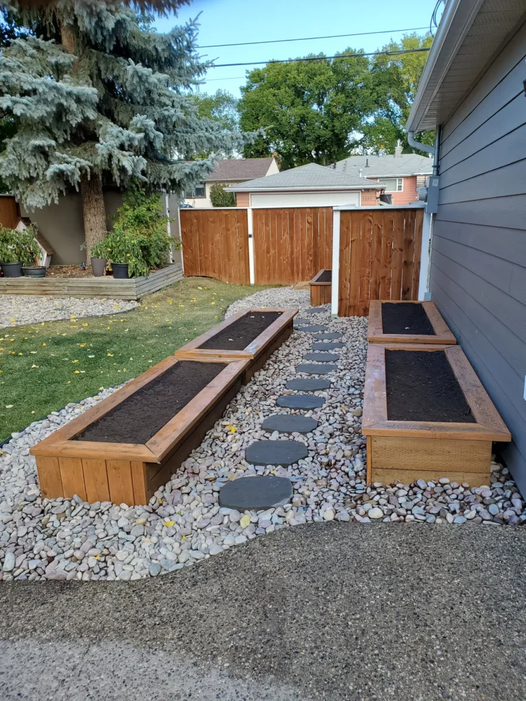 stone walking path in a backyard by Lush Landscaping