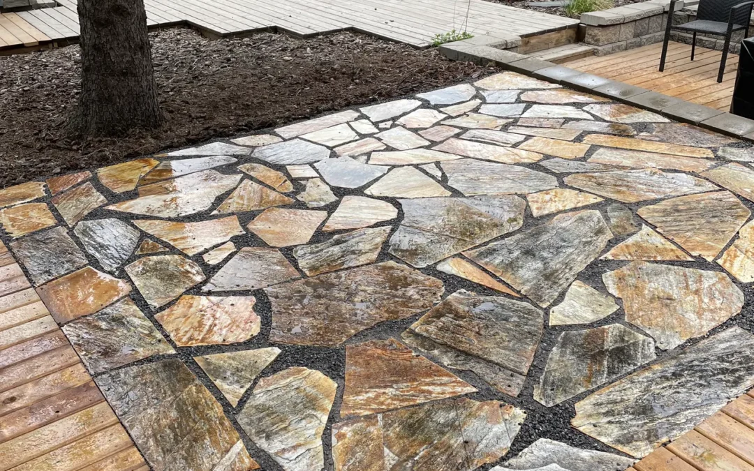 Stone patio in a backyard by Lush Landscaping in Edmonton