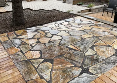 Stone patio in a backyard by Lush Landscaping in Edmonton