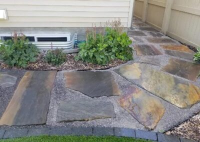 walkway construction in front of a house in Edmonton by Lush Landscaping