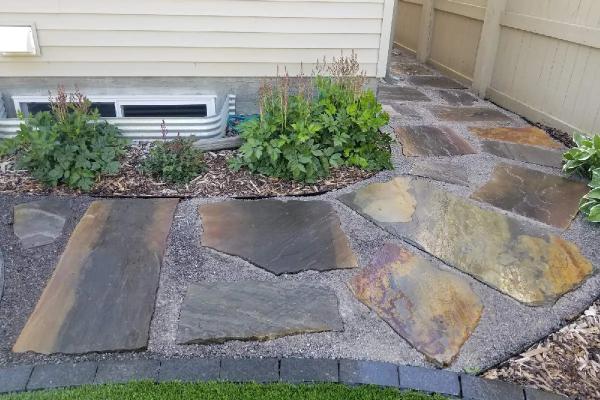 walkway construction in front of a house in Edmonton by Lush Landscaping