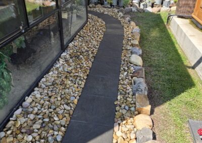 walkway and grading in a backyard