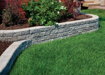 stone retaining wall and lush garden
