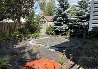 A backyard rock garden completed by Lush Landscaping